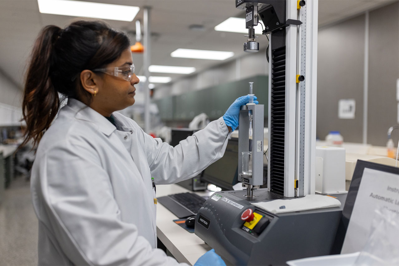 Pii scientist developing and testing prefilled syringes.