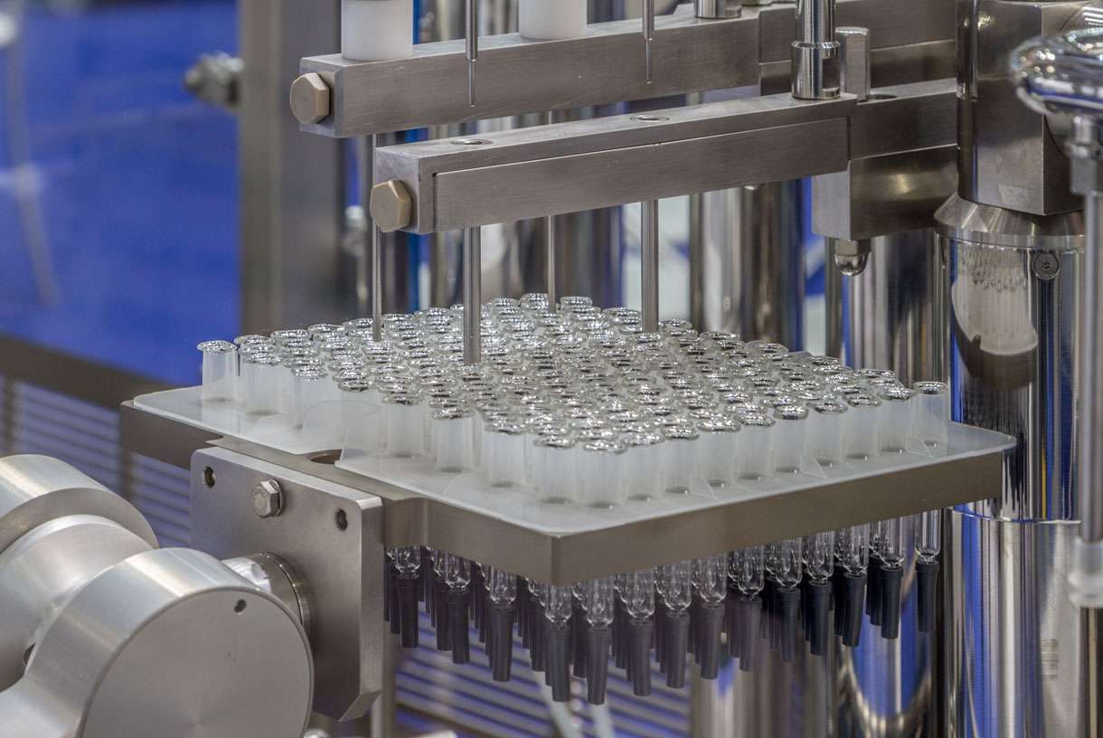 A high-speed vial filling robotic aseptic commercial drug manufacturing fill-finish line.